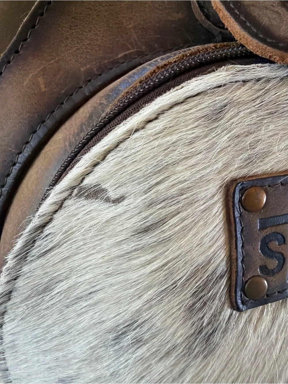 STS Ranchwear Brown Leather Backpack with White Speckled Haircalf Front